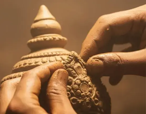 Hand-sculpting a Panchagavya Ganesha idol
